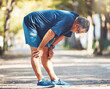 Exercise, senior man and tired outdoor, breathing and balance for wellness, health and retirement. Elderly male, athlete and resting for workout, runner and exhausted for fitness, training and cardio