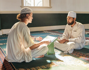 Wall Mural - Quran, muslim and mosque with an imam teaching a student about religion, tradition or culture during eid. Islam, book or worship with a religious teacher and islamic male praying together for ramadan