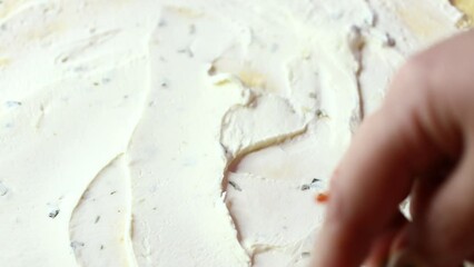 Poster - flatbread is spread with cottage cheese with a spoon