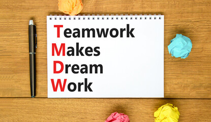 Wall Mural - TMDW Teamwork makes dream work symbol. Concept words TMDW Teamwork makes dream work on white note on beautiful wooden background. Business TMWD teamwork makes dream work concept. Copy space.