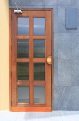 Door and granite wall background at the cafe.