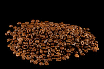 Wall Mural - Coffee beans on a black background.