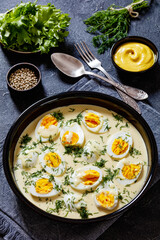 Wall Mural - Senfeier, hard boiled eggs in creamy mustard sauce