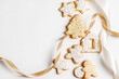 © The Picture Pantry - Christmas cookies with icing on a white background with ribbon