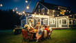 © Gorodenkoff - Group of Multiethnic Diverse People Having Fun, Sharing Stories with Each Other and Eating at Outdoors Dinner Party. Family and Friends Gathered Outside Their Home on a Warm Summer Evening.