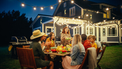 Wall Mural - Group of Multiethnic Diverse People Having Fun, Communicating with Each Other and Eating at Outdoors Dinner. Family and Friends Gathered Outside Their Home on a Warm Summer Evening.