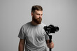 © Volodymyr - Professional cameraman with a camera gimbal. Filmmaking, videography, hobby and creativity concept.