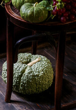 Autumn Composition With Green Pumpkins And Grapes. Concept Of Thanksgiving Or Halloween