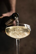 © The Picture Pantry - Prosecco pour into coupe glass