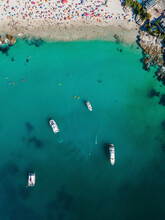 Aerial View Of Clifton 4th Pristine Beach With Luxury Yachts Docked And White Sand And Blue Ocean With People Swimming In Summer, Cape Town, South Africa.