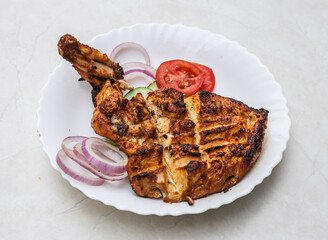 bbq chicken tikka breast piece served in plate isolated on table top view of indian and pakistani spicy food