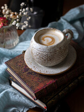 Cup Of Coffee On Vintage Books