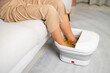 Woman do foot bath herself at home
