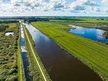 Aerial View Of Canal Hooidamsloot With Bicycle Path And Reedlands In National Park De Alde Feanen, Earnewald, Friesland, Netherlands.