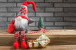 Cute Christmas gnome and festive decor on table. Space for text