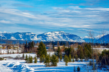 Wall Mural - Montana winter scene of teakettle mountain in the background, with areas of the town of Whitefish in the foreground.