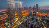 Fototapeta Nowy Jork - Futuristic Dubai Downtown and finansial district skyline aerial night to day timelapse.