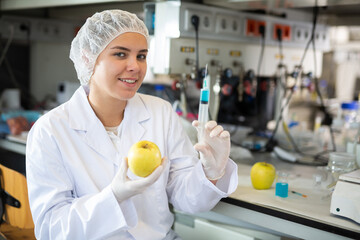 Portrait of confident young woman technical expert provide GMO analysis service in modern food testing laboratory