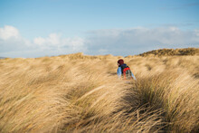 Woman Walks Through High Dune Grass, Berneray, Outer Hebrides, Scotland