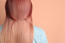 Woman With Bright Dyed Hair On Pale Pink Background, Back View. Space For Text