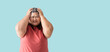 Asian fat woman, Fat girl , Chubby, overweight unhappy measuring her,  isolated on blue background