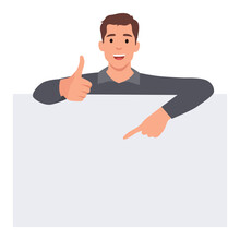 Young Man Is Standing Behind The White Blank Banner And Pointing Down At A Copy Space With One Thumb Up. Flat Vector Illustration Isolated On White Background