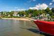 Historic boat and city beach at the waterfront of the Elbe River in Hamburg, Germany