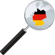 Germany map with flag in magnifying glass.