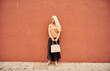 © Cavan Images - Stylish female standing by wall