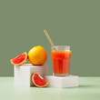 Freshly Squeezed Grapefruit Juice. Grapefruit juice and ripe grapefruits on minimalistic background.Creative minimal concept. Minimal food creative concept. Grapefruit slices citrus fruits. 