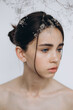 © Ananass - Stylish portrait of a young girl with gypsophila flowers and natural light, natural girlish beauty without makeup, minimalism and sophistication.