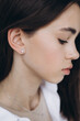 © Ananass - stylish portrait of a young 15-year-old model girl with natural light in a spacious photo studio