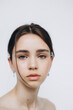 © Ananass - stylish portrait of a young 15-year-old model girl with natural light in a spacious photo studio