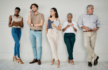 Hiring, human resources or people in a waiting room for a marketing job interview at a office building. Onboarding, men and business women with career goals wait as a group for company hr manager