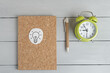 alarm clock, notepad for writing, pen. Planing koncept. Yop view. Biznes koncept