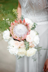 Wall Mural - Wedding flowers. Bridal bouquet with exotic flowers. The bride is holding a bouquet. soft focus