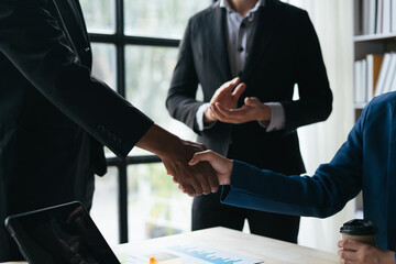 Wall Mural - Business handshake for teamwork of business merger and acquisition,successful negotiate,hand shake,two businessman shake hand with partner to celebration partnership and business deal concept.