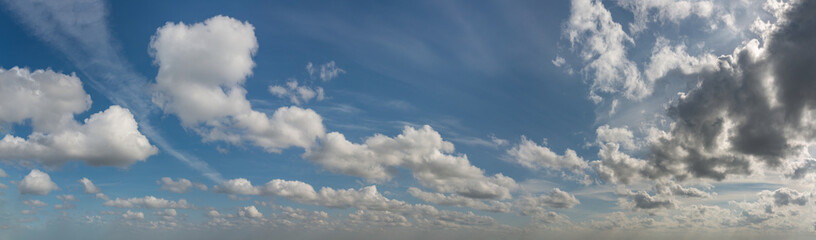 Wall Mural - fantastic clouds against blue sky, panorama