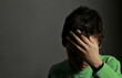 © herlanzer - child praying to God with hands together with black background with people stock photo