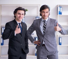 Two young businessmen meeting in the office