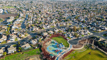 Wall Mural - Drone photo over a suburb in Oakley, Calfornia with roads and houses