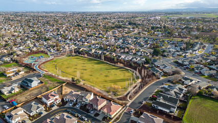 Wall Mural - Drone photo over a suburb in Oakley, Calfornia with roads and houses