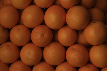 Wall Mural - Orange in a row on a market