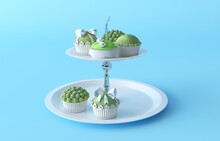 Illustration Of A Cupcake Stand With Cupcakes. Plastic Decorated Green Cupcakes With Bow And Balls On A Metal Round Multi-level Stand. 3d Render Illustration Isolated On Blue Background. 