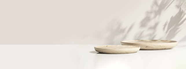 two minimal modern wooden round tray podium on white glossy table counter in sunlight, leaf shadow o