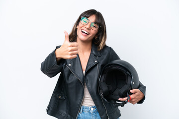 Young caucasian woman with a motorcycle helmet isolated on white background with thumbs up because something good has happened