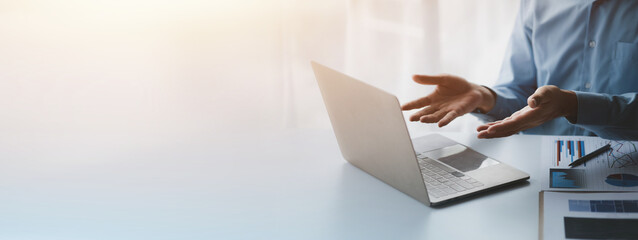 Business people meeting online on laptop via online meeting program with executives and marketing department managers, teleconferencing. The concept of using technology in a business meeting.