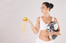Fitness, Health And Woman With Scale And Apple For Weightloss, Diet And Nutrition On White Studio Background. Exercise, Wellness And Girl With Fruit, Balance And Measuring Tape For Healthy Lifestyle