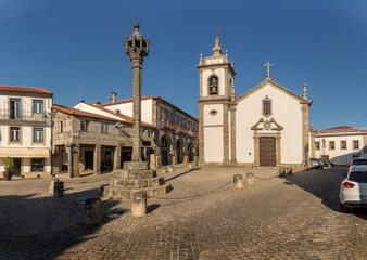 Wall Mural - View of the pillory and church of Saint Peter in the historic center of the city of Trancoso in Portugal.