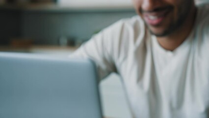 Cropped view moving shooting close up male hands typing laptop African happy smiling man guy freelancer user gamer play computer game work online from home chatting browsing in internet app website